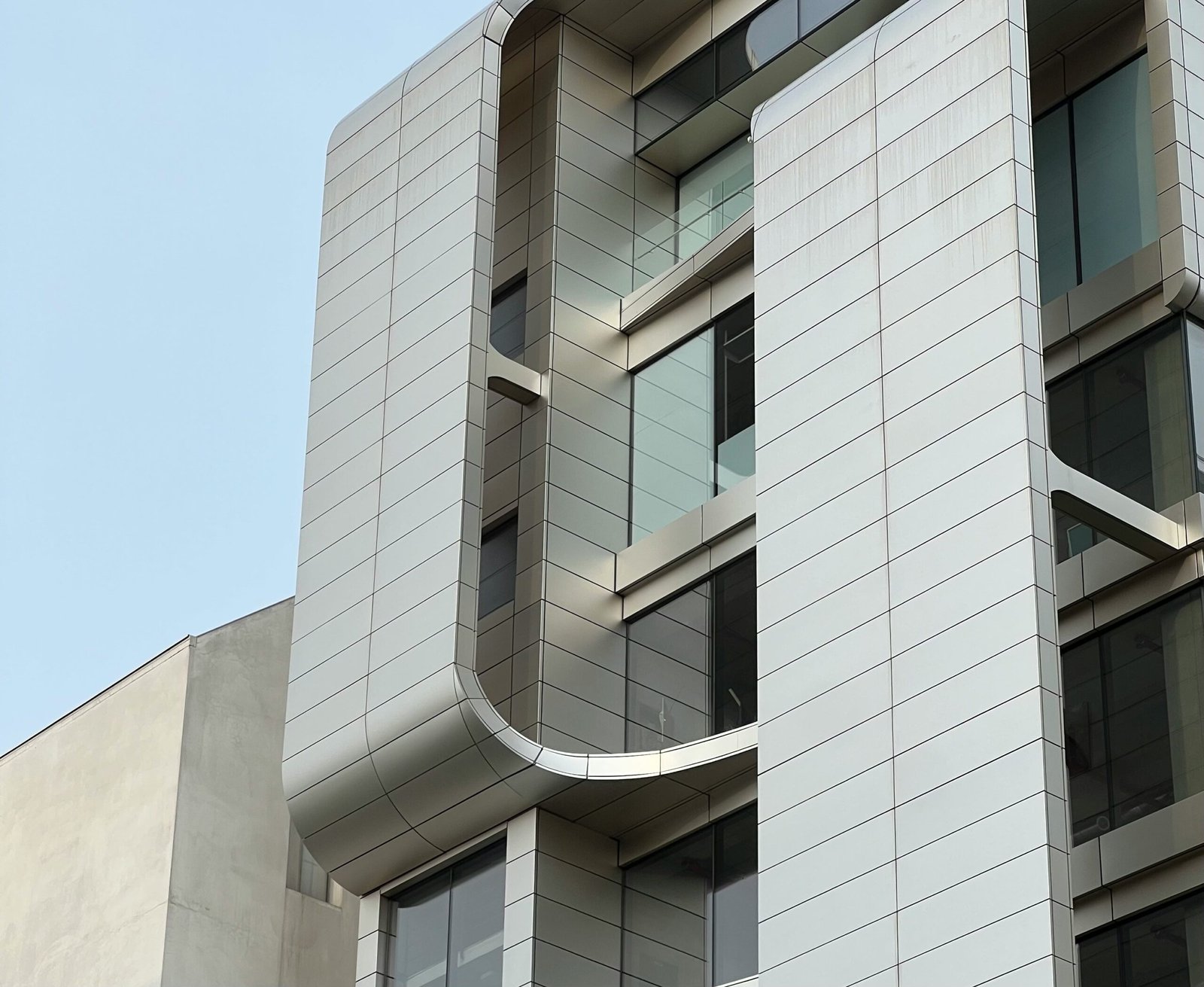 A tall building with lots of windows on top of it